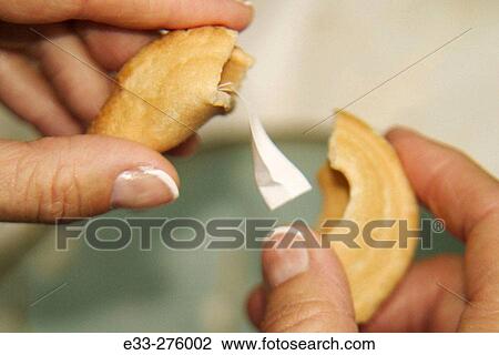 Opening fortune cookie View Large Photo Image Stock Image - Opening fortune cookie. Fotosearch