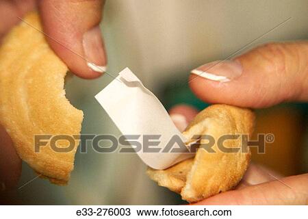 Opening fortune cookie View Large Photo Image Stock Image - Opening fortune cookie. Fotosearch