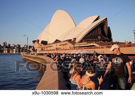 Opera Bar customers in front of the famous opera in Sydney, New South Wales, Australia View Large Photo Image Stock Photo - Opera Bar customers in front of the famous opera in Sydney, New South Wales, Australia. Fotosearch