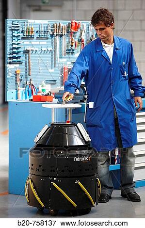 Stock Photo - Operator using Mugiro multipurpose mobile platform developed by Fatronik-Tecnalia, Research and Technology Center, Donostia, Basque Country, Spain. Fotosearch