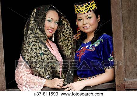 Stock Photo - Orang Ulu woman and Malay woman.. Fotosearch