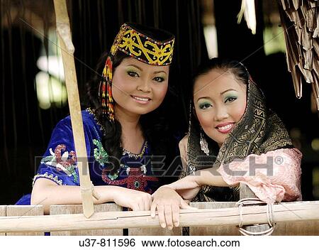 Orang Ulu woman and Malay woman. View Large Photo Image Stock Photograph - Orang Ulu woman and Malay woman.. Fotosearch