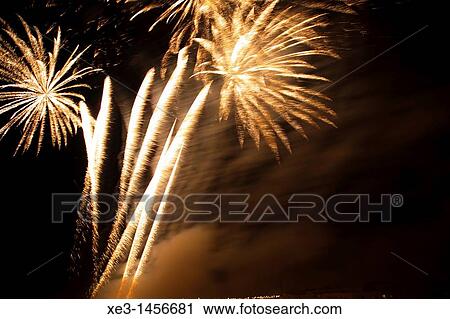 Stock Image - Orange fireworks. Fotosearch