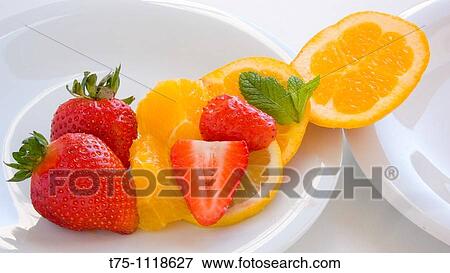 Orange, lemon, strawberries and mint leaves View Large Photo Image Stock Photo - Orange, lemon, strawberries and mint leaves. Fotosearch