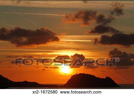 Stock Image - Orange sunset in Getaria, Basque Country, Spain.. Fotosearch