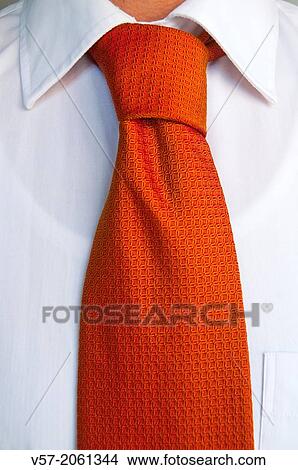 Orange tie on white shirt. Close view. View Large Photo Image Picture - Orange tie on white shirt. Close view.. Fotosearch