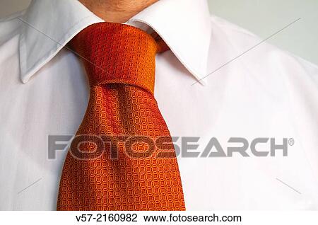 Orange tie on white shirt. Close view. View Large Photo Image Stock Image - Orange tie on white shirt. Close view.. Fotosearch
