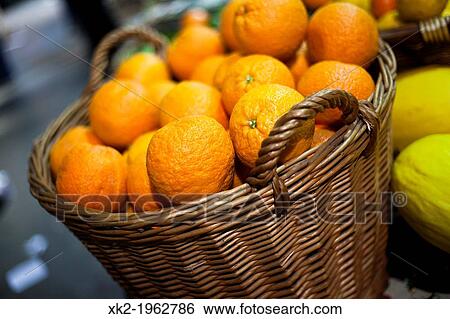 Oranges in a wicker basket in Borough Market, London, UK View Large Photo Image Stock Photograph - Oranges in a wicker basket in Borough Market, London, UK. Fotosearch
