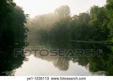 Orb river in early morning haze, Herault, France. View Large Photo Image Stock Image - Orb river in early morning haze, Herault, France.. Fotosearch