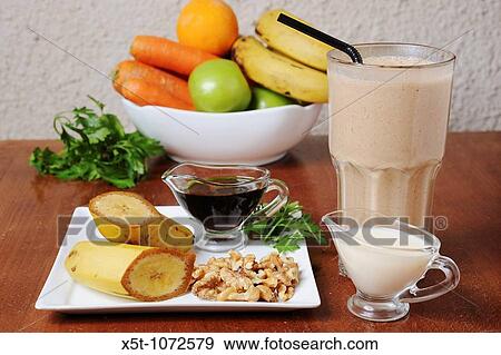 Stock Photo - Organic Health Food meal Fruit, vegetables and a shake drink. Fotosearch