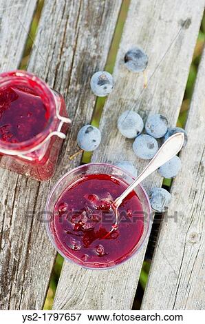 Stock Photo - Organic marmalade from bullace plums in a glass bowl a glass bowl. Fotosearch