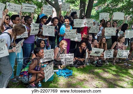 Stock Photo - Organized by NYC Council member Laurie A. Cumbo and the group Hollaback!, young women and teenagers participate in a??Girl Power?? art workshop in Fort Greene Park in Brooklyn in New York.. Fotosearch