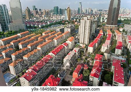 Organized rows of housing in Pudong, Shanghai, China Rapid modernization and development has lead to cheap track housing that displaces traditional communities View Large Photo Image Stock Image - Organized rows of housing in Pudong, Shanghai, China Rapid modernization and development has lead to cheap track housing that displaces traditional communities. Fotosearch