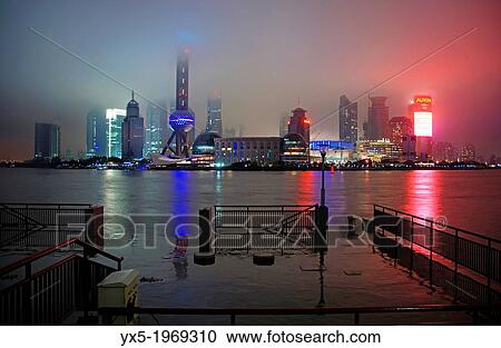 Oriental Pearl TV tower and Pudong skyline at rainy night, Shanghai, China. View Large Photo Image Stock Image - Oriental Pearl TV tower and Pudong skyline at rainy night, Shanghai, China.. Fotosearch