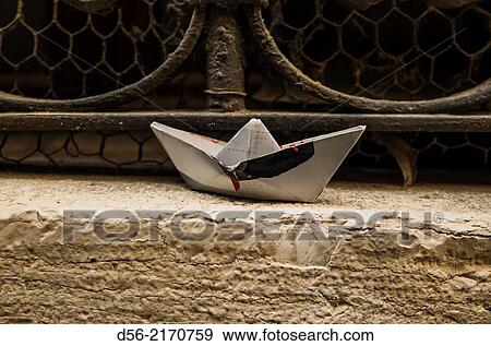 Origami paper boat on a window, Venice, Italy. View Large Photo Image Stock Photo - Origami paper boat on a window, Venice, Italy.. Fotosearch