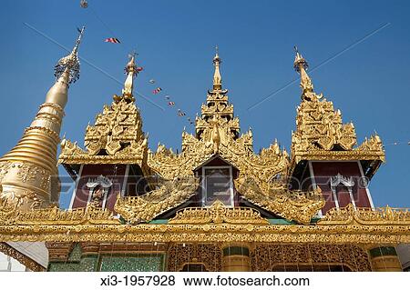 Ornate roof of a building and a stupa at Shwedagon Pagoda, Yangon, (Rangoon), Myanmar, (Burma). View Large Photo Image Stock Photo - Ornate roof of a building and a stupa at Shwedagon Pagoda, Yangon, (Rangoon), Myanmar, (Burma).. Fotosearch