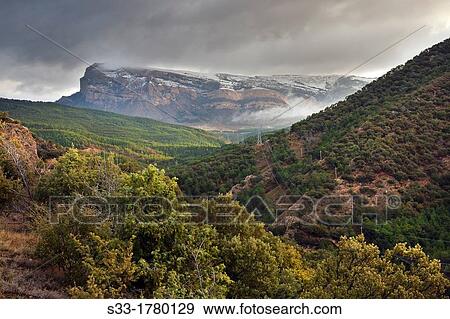 Oroel cliff from the Sierra de San Juan de la Pea Huesca Arag? n Spain View Large Photo Image Stock Photo - Oroel cliff from the Sierra de San Juan de la Pea Huesca Arag? n Spain. Fotosearch
