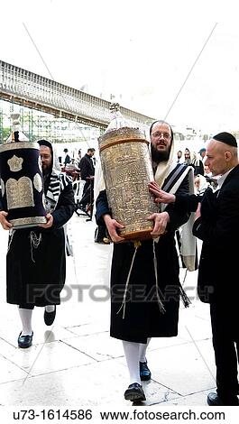 Orthodox Jewish men holding Torah scroll books by the Wailing wall in the old city of Jerusalem. View Large Photo Image Stock Photograph - Orthodox Jewish men holding Torah scroll books by the Wailing wall in the old city of Jerusalem.. Fotosearch