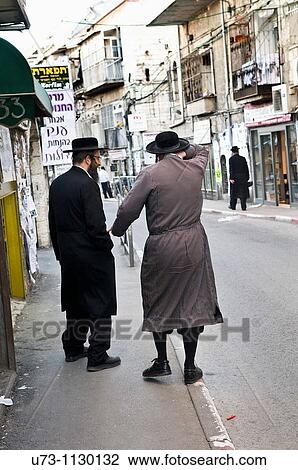 Orthodox men walking the streets of Mea Shearim neighborhood in Jerusalem. View Large Photo Image Stock Image - Orthodox men walking the streets of Mea Shearim neighborhood in Jerusalem.. Fotosearch