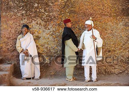 Orthodox priest and Christian devotees at the church of Bieta Maryam, Lalibela, Ethiopia View Large Photo Image Stock Photo - Orthodox priest and Christian devotees at the church of Bieta Maryam, Lalibela, Ethiopia. Fotosearch