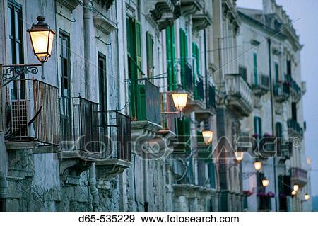Ortygia Island-Streetlights- via R. Settimo in the evening, Syracuse. Sicily, Italy View Large Photo Image Stock Photo - Ortygia Island-Streetlights- via R. Settimo in the evening, Syracuse. Sicily, Italy. Fotosearch
