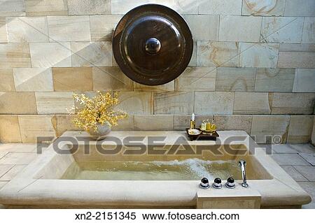 Outdoor bath on private patio in a suite at Amanjiwo resort, near Borobudur, Magelang, Central Java, Indonesia View Large Photo Image Stock Photography - Outdoor bath on private patio in a suite at Amanjiwo resort, near Borobudur, Magelang, Central Java, Indonesia. Fotosearch