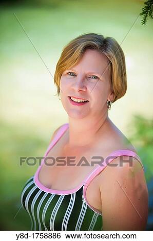 Outdoor portrait of 45 years old caucasian woman View Large Photo Image Stock Photograph - Outdoor portrait of 45 years old caucasian woman. Fotosearch