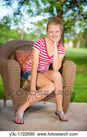 Stock Image - Outdoor portrait of blond teenage girl. Fotosearch