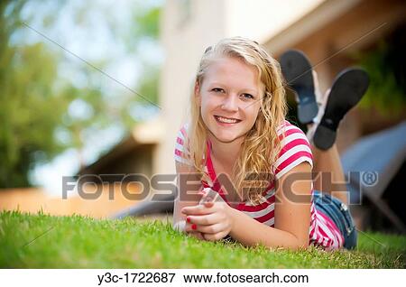 Outdoor portrait of blond teenage girl View Large Photo Image Stock Photo - Outdoor portrait of blond teenage girl. Fotosearch