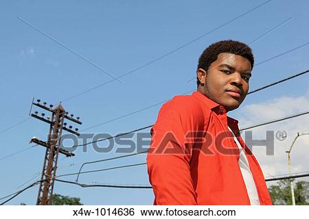 Outdoor portrait of young African American gay man View Large Photo Image Stock Photograph - Outdoor portrait of young African American gay man. Fotosearch