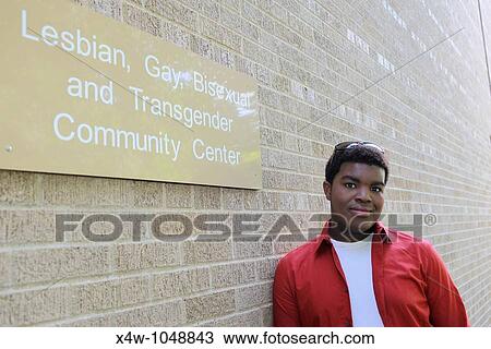 Outdoor portrait of young gay African-American man standing outside of gay community center View Large Photo Image Stock Image - Outdoor portrait of young gay African-American man standing outside of gay community center. Fotosearch