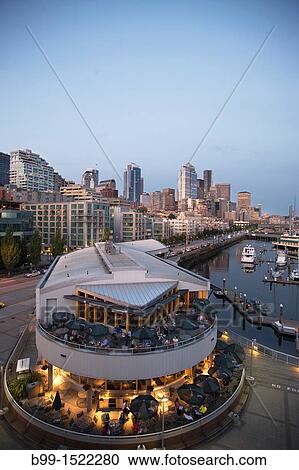 OUTDOOR RESTAURANT PIER 66 BELL STREET MARINA ELLIOT BAY DOWNTOWN SKYLINE SEATTLE WASHINGTON STATE USA View Large Photo Image Stock Image - OUTDOOR RESTAURANT PIER 66 BELL STREET MARINA ELLIOT BAY DOWNTOWN SKYLINE SEATTLE WASHINGTON STATE USA. Fotosearch