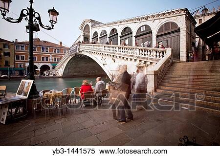 Stock Photography - Outdoor Restaurant, The Rialto Bridge, Venice, Italy. Fotosearch