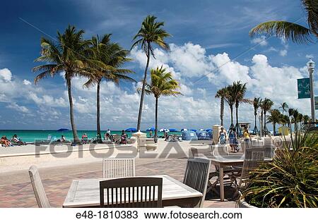 OUTDOOR SIDEWALK CAFE ON BEACHFRONT PROMENADE HOLLYWOOD BEACH FLORIDA USA View Large Photo Image Stock Image - OUTDOOR SIDEWALK CAFE ON BEACHFRONT PROMENADE HOLLYWOOD BEACH FLORIDA USA. Fotosearch