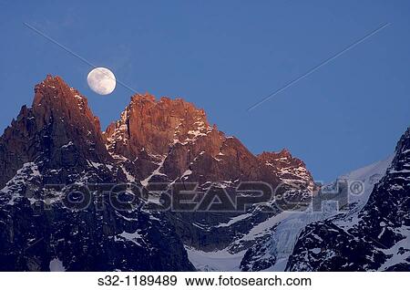 output moon in a warm evening in the hands of chamonix, alps, france View Large Photo Image Stock Photo - output moon in a warm evening in the hands of chamonix, alps, france. Fotosearch