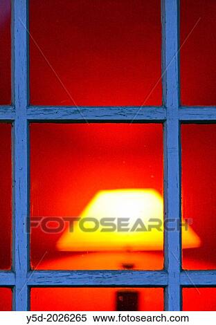 Outside-in looking into a warm family home with ambient lighting View Large Photo Image Stock Photography - Outside-in looking into a warm family home with ambient lighting. Fotosearch
