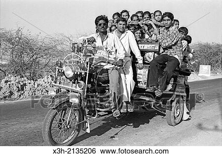 overloaded tricycle with young passengers, Gujarat, India, South Asia. View Large Photo Image Stock Photograph - overloaded tricycle with young passengers, Gujarat, India, South Asia.. Fotosearch