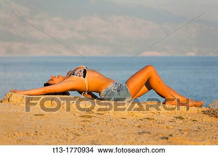Overstretched on the edge young woman View Large Photo Image Picture - Overstretched on the edge young woman. Fotosearch