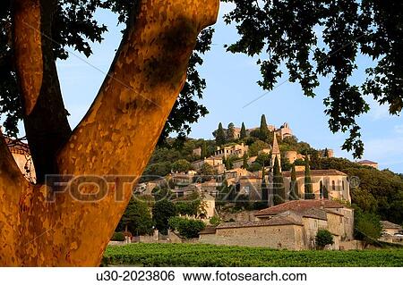 Stock Photograph - Overview of Roque-sur-Ceze, labelled The Most Beautiful Villages of France, in Gard deparment, Languedoc-Roussillon region. France.. Fotosearch