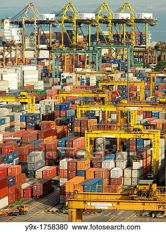Stock Image - Overview of the Port of Singapore Authority PSA in Singapore PSA Singapore Terminals is the world largest container transhipment hub, handling about one-fifth of the world's total container transhipment throughput. Fotosearch