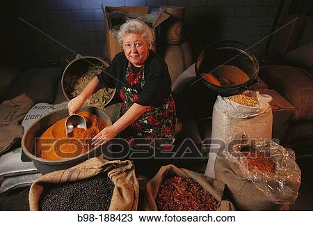 Owner of spice shop inspecting inventory View Large Photo Image Stock Image - Owner of spice shop inspecting inventory. Fotosearch