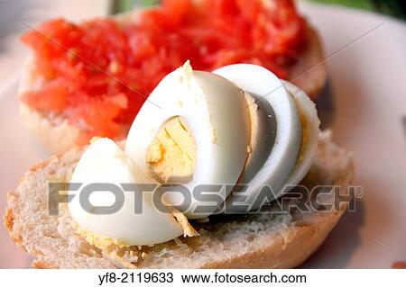 Stock Image - pa amb tomaquet, bread with tomato and boiled egg, typical of Catalonia, Spain.. Fotosearch
