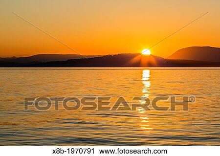 Pacific Northwest sunset, Haro Strait, Saturna Island, British Columbia, Canada. View Large Photo Image Stock Image - Pacific Northwest sunset, Haro Strait, Saturna Island, British Columbia, Canada.. Fotosearch