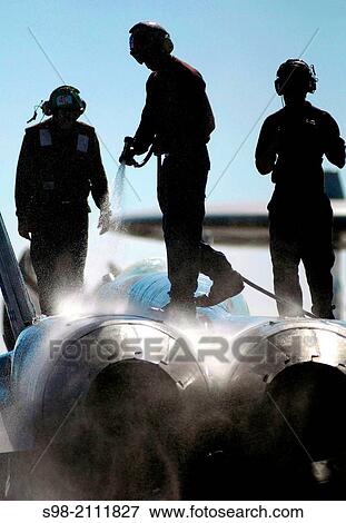 PACIFIC OCEAN (March 24, 2008) Sailors assigned to """"Blue Blasters"""" of Strike Fighter Squadron (VFA) 34 wash down an F/A-18C Hornet on the flight deck aboard the Nimitz-class aircraft carrier USS Abraham Lincoln (CVN 72). View Large Photo Image Stock Photo - PACIFIC OCEAN (March 24, 2008) Sailors assigned to """"Blue Blasters"""" of Strike Fighter Squadron (VFA) 34 wash down an F/A-18C Hornet on the flight deck aboard the Nimitz-class aircraft carrier USS Abraham Lincoln (CVN 72).. Fotosearch