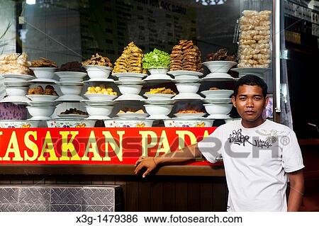 Padang food is very popular on Bali. The food is pre-prepared and placed on display where you go and choose what you would like to eat. Kuta, Bali, Indonesia View Large Photo Image Stock Photograph - Padang food is very popular on Bali. The food is pre-prepared and placed on display where you go and choose what you would like to eat. Kuta, Bali, Indonesia. Fotosearch