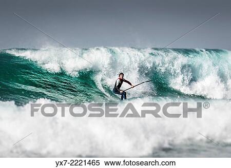 Stock Photography - Paddle surfing. Tarifa, Cadiz, Costa de la Luz, Andalusia, Spain, Europe. Fotosearch