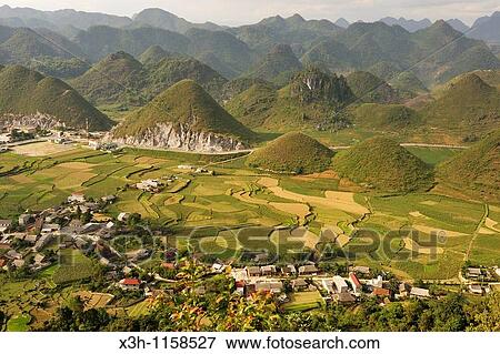 Stock Photo - paddy-fields around Tam Son village viewed from Quan Ba Pass on the road to Yen Minh, Ha Giang province, northern Vietnam, southeast asia. Fotosearch