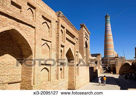 Pahlavan Mahmud Mausoleum on left and Islam Khodja Minaret, Ichan Kala, Khiva, Uzbekistan. View Large Photo Image Stock Photo - Pahlavan Mahmud Mausoleum on left and Islam Khodja Minaret, Ichan Kala, Khiva, Uzbekistan.. Fotosearch