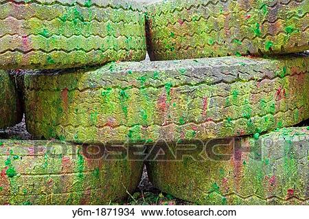 Paint covered barricade made of tires on paintball field, Oregon View Large Photo Image Picture - Paint covered barricade made of tires on paintball field, Oregon. Fotosearch