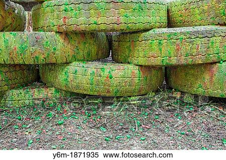 Paint covered barricade made of tires on paintball field, Oregon View Large Photo Image Stock Photography - Paint covered barricade made of tires on paintball field, Oregon. Fotosearch